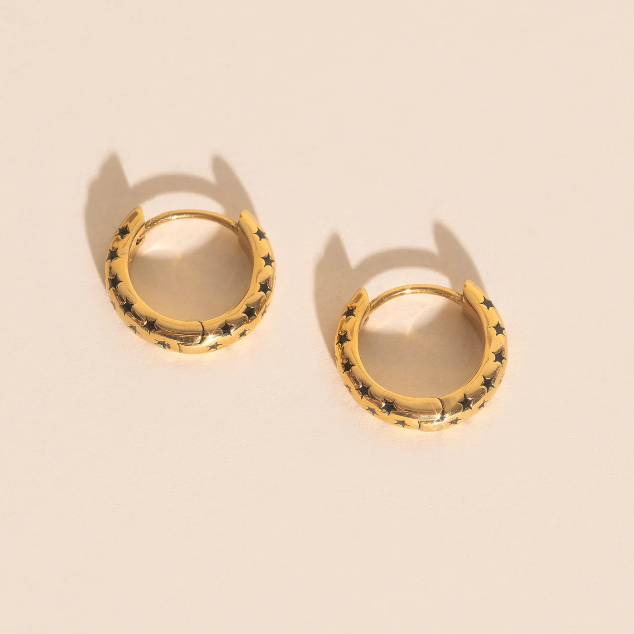 Black Star Chunky Huggie Hoop Earrings - Image 4