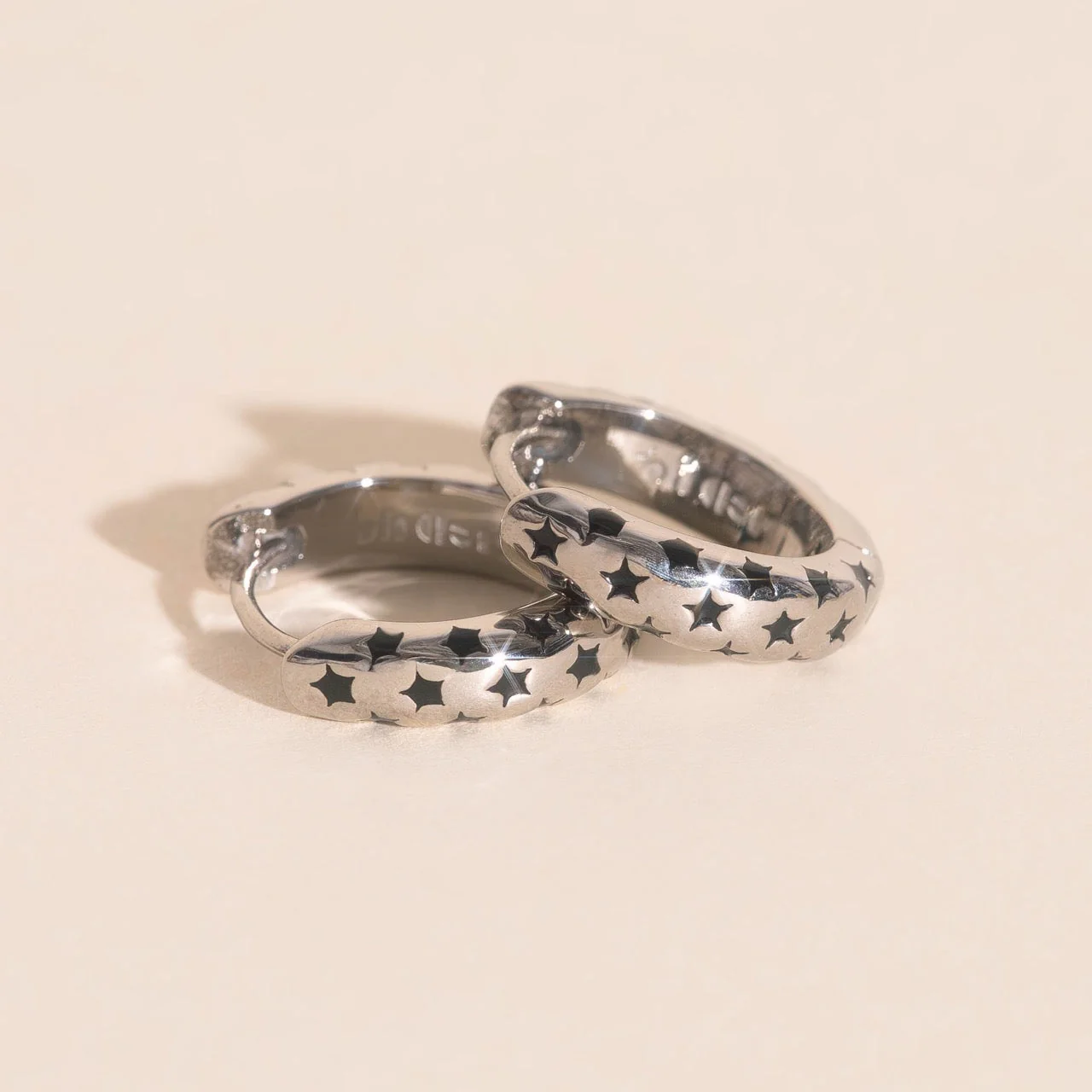 Black Star Chunky Huggie Hoop Earrings - Image 5