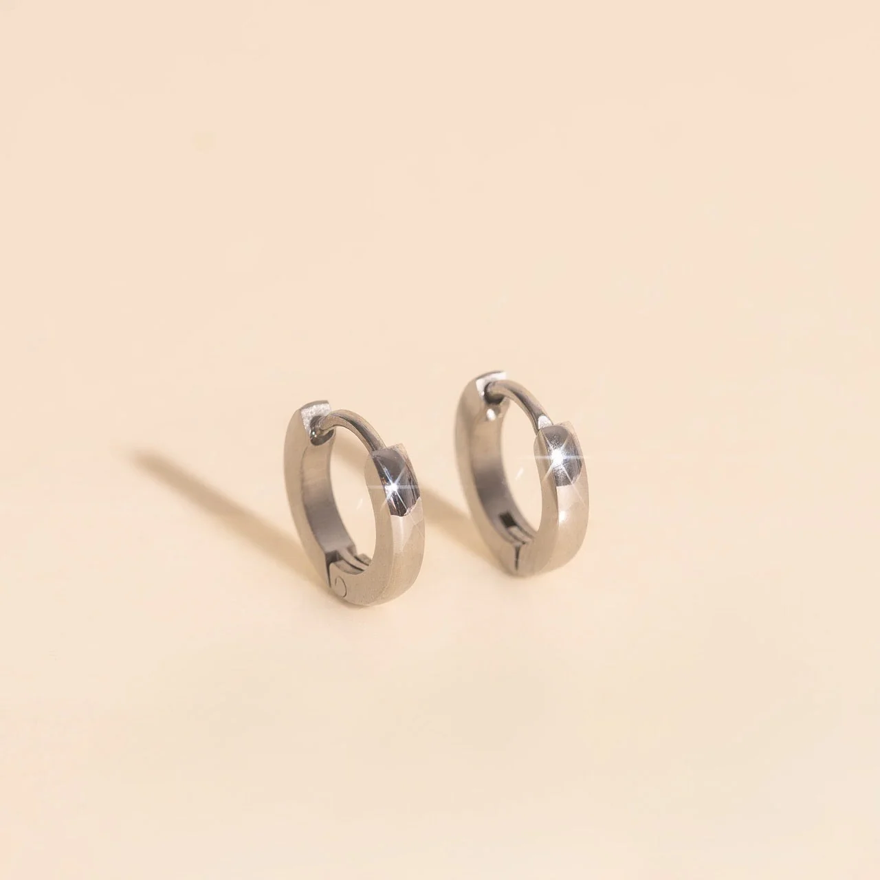 Smooth Tiny Huggie Hoop Earrings - Image 3