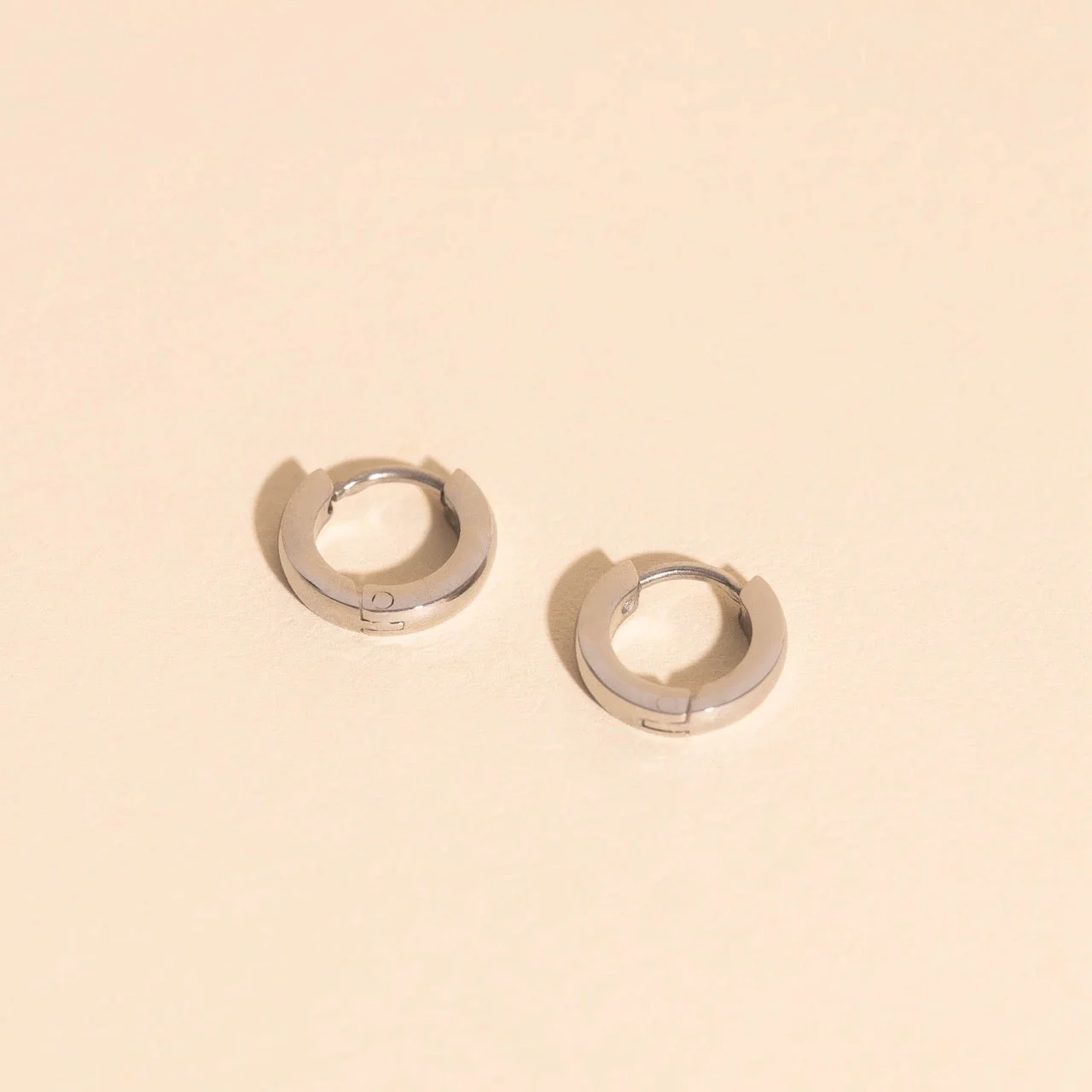 Smooth Tiny Huggie Hoop Earrings - Image 5