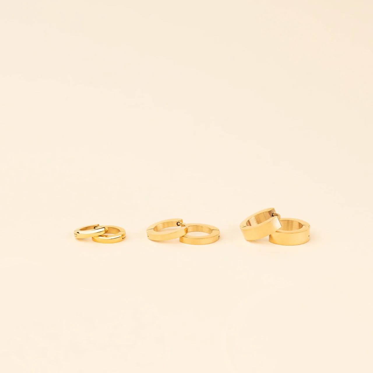 Smooth Tiny Huggie Hoop Earrings - Image 7